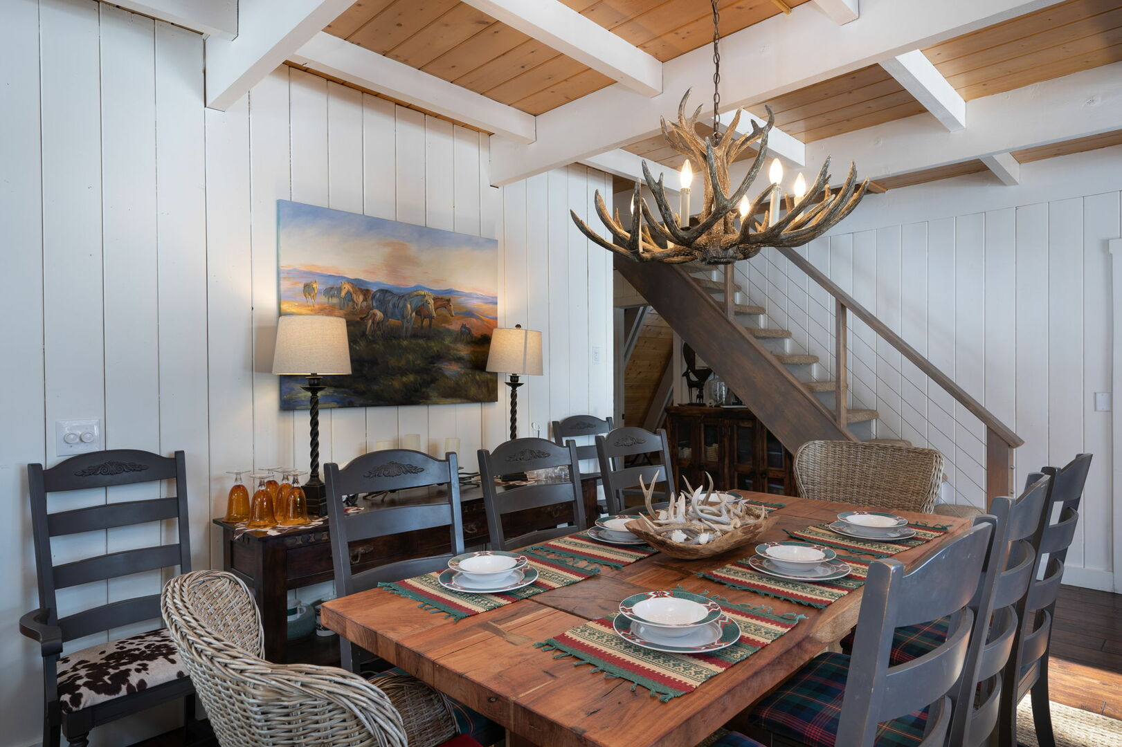 The dining room and antler chandelier of one of our Durango Rentals