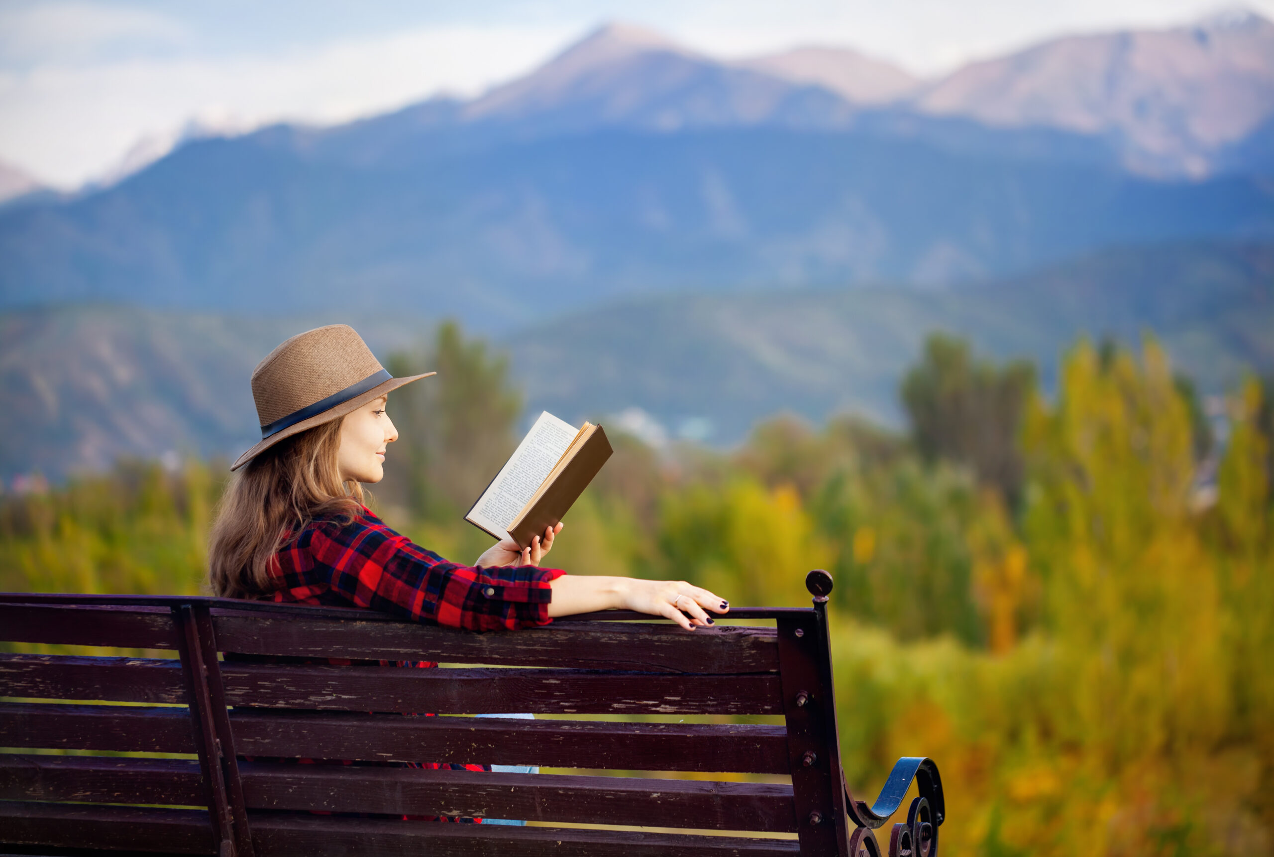 Woman on the bench with book